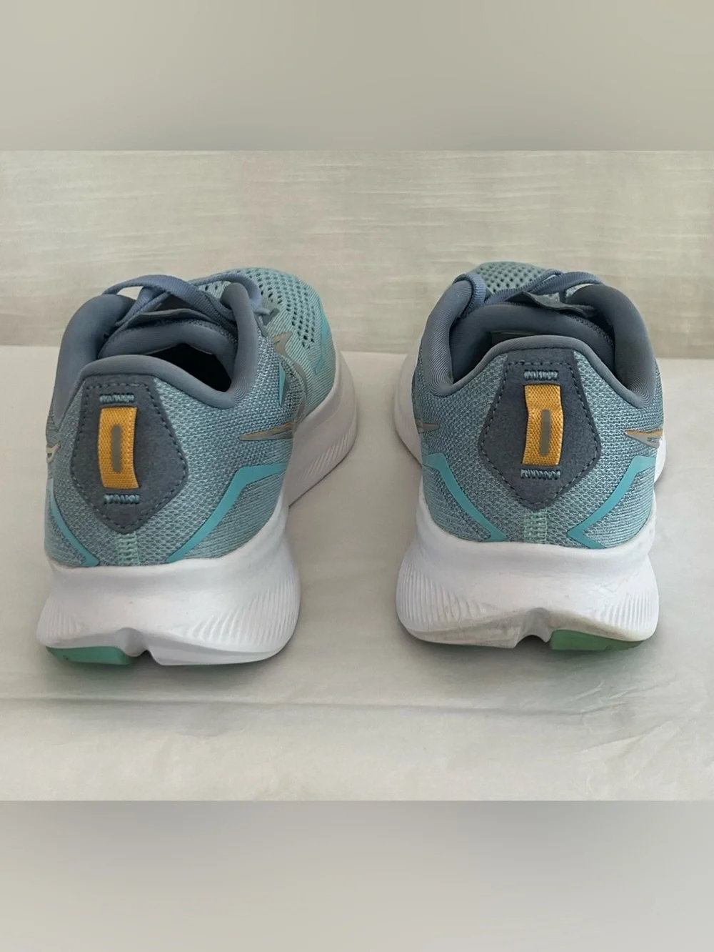 Saucony Ride 15 Women's Light Blue Athletic Sneakers with Yellow Accents